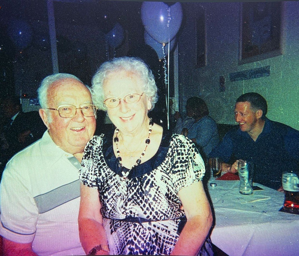 The same photograph, original with a colour cast from venue lighting