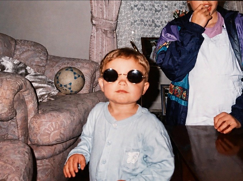 Toddler in sunglasses, restored and enhanced
